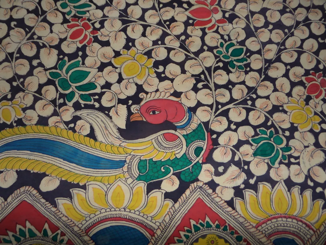 Hand-painted Kalamkari cloth at Srikalahasti in Andhra Pradesh — one of the printed and painted cloth traditions of the Telugu country where the community's families have long worked